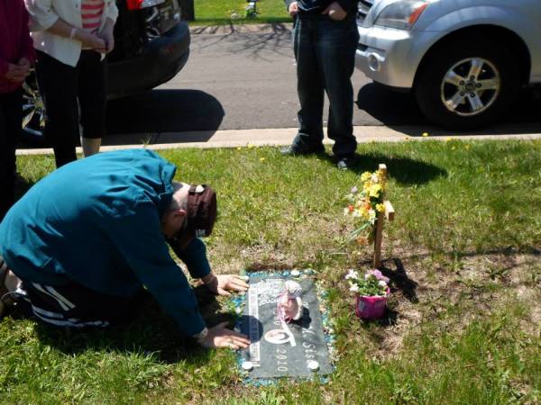 Mr. Ed Dean praying at Kay's Grave